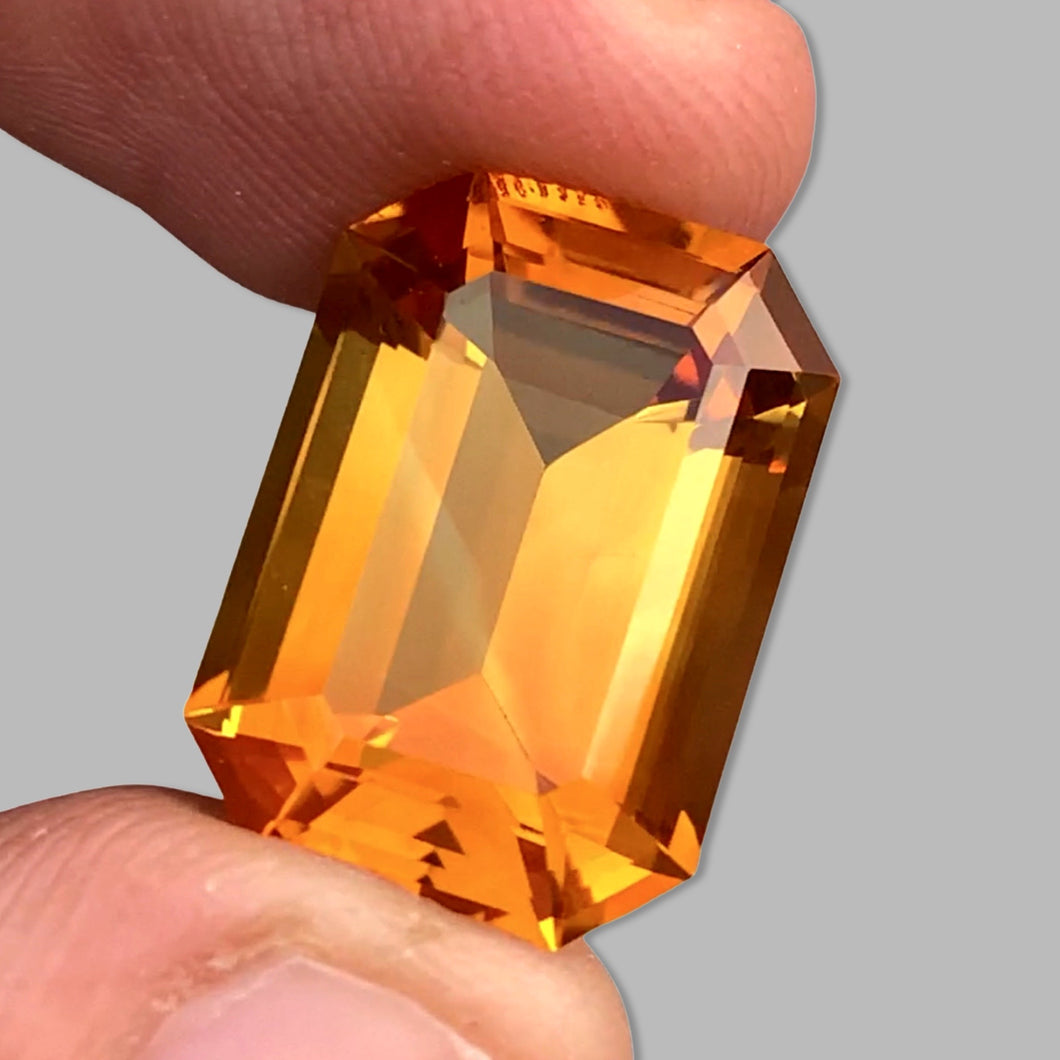 Flawless 14.34 CT Excellent Emerald Cut Full of Fire Mandarin Citrine.